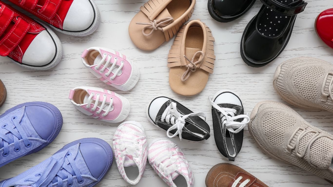 different types of children shoes in pairs