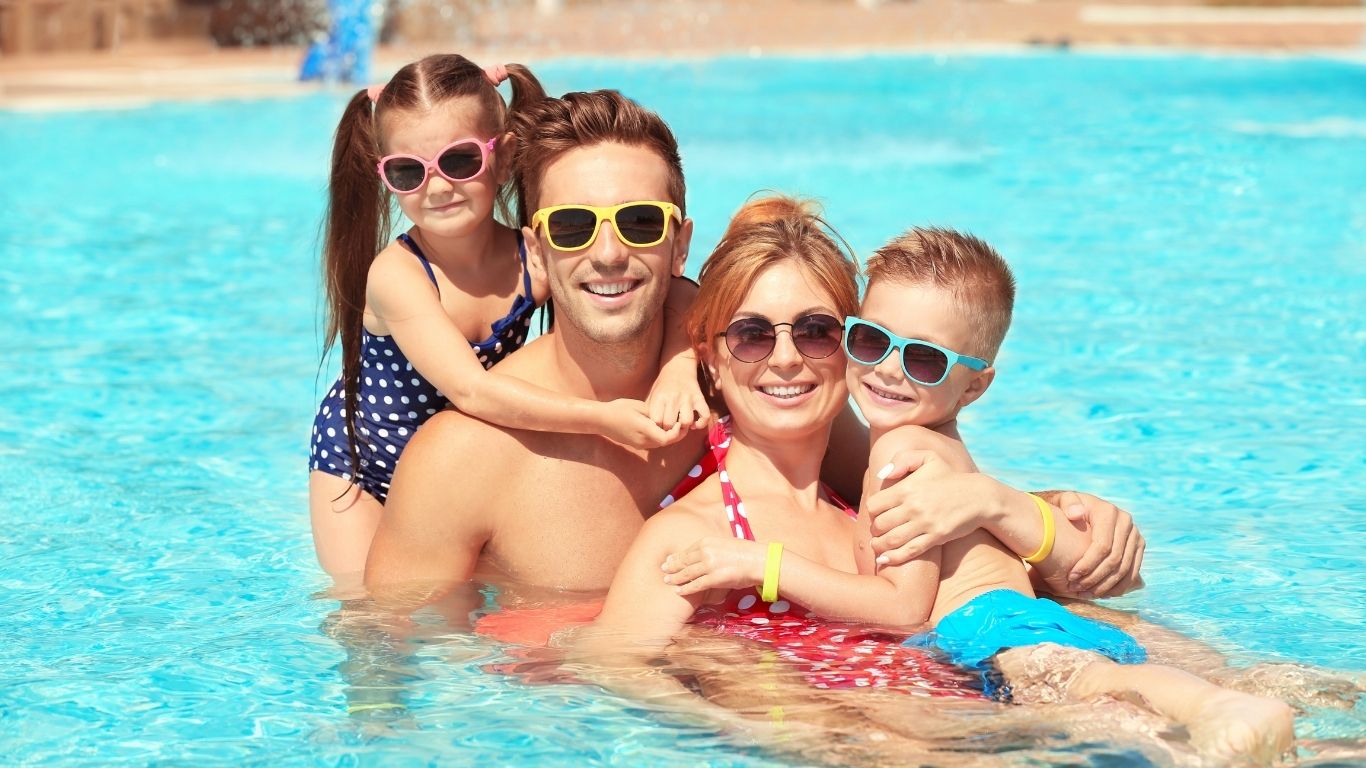 Children with family in pool
